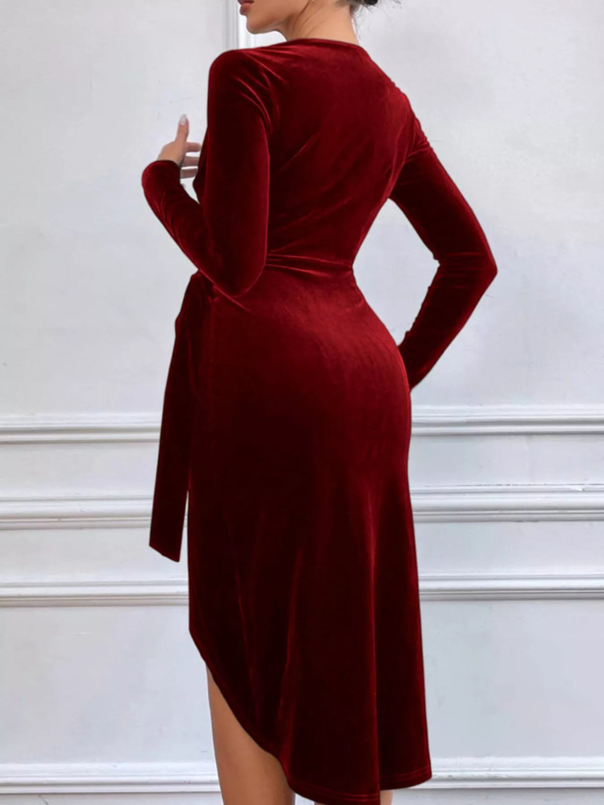 Wine red long-sleeve velvet midi dress, back view.